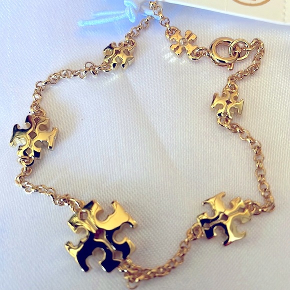 Tory Burch Jewelry - NWT  TORI BURCH GOLD LOGO BRACELET .